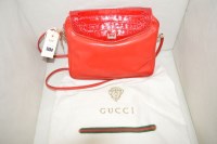 Lot 1384 - A red leather and stained crocodile skin Gucci...