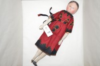 Lot 1398 - An early 20th Century wooden Peg doll, in...