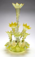 Lot 302 - Vaseline glass epergne, the tall central flute...