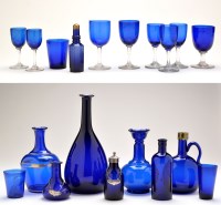 Lot 306 - Various blue glass bottles; moon-shaped...