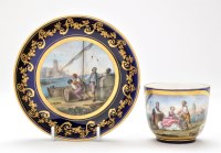 Lot 372 - A Sevres style blue ground cup and saucer, in...