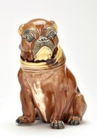 Lot 388 - Majolica 'Pug Dog' tobacco jar and cover,...