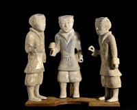 Lot 396 - Three Chinese pottery Groom Funerary figures,...