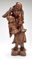 Lot 428 - Japanese carved wooden group of a figure...