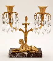 Lot 527 - A giltmetal candelabra of Egyptian influence,...