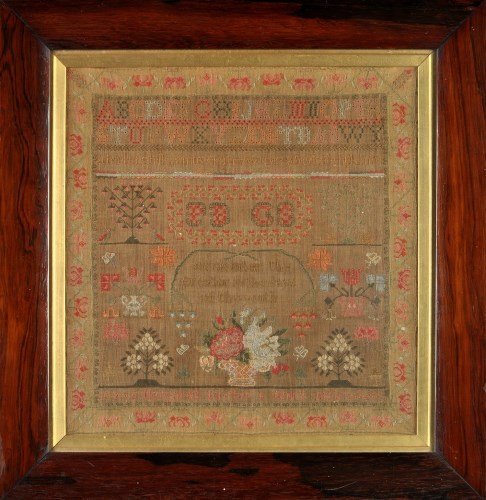 Lot 535 - A mid 19th Century needlework sampler, worked...