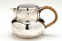 Lot 556 - A George V hot water jug, by Goldsmiths &...