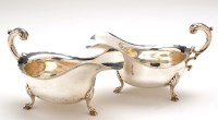 Lot 579 - A near matching pair of George V gravy boats,...