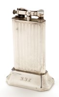 Lot 655 - A George V silver tabletop lighter, by Alfred...