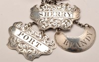 Lot 668 - Two Victorian silver decanter labels, by...