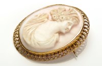 Lot 715 - A late 19th Century carved pink coral cameo...