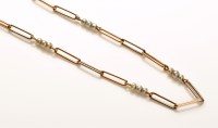 Lot 720 - A yellow and white metal necklace chain of...