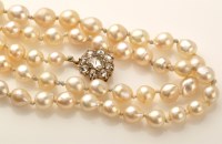 Lot 736 - A single row of cultured pearls, each strung...