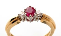 Lot 740 - A ruby and diamond ring, the central oval...