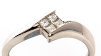 Lot 743 - A diamond ring, the four princess cut diamonds...