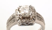 Lot 744 - A diamond ring, the central brilliant cut...