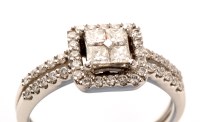 Lot 746 - A diamond cluster ring, the central plaque set...