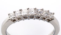 Lot 749 - A seven stone diamond ring, the princess cut...