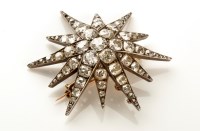 Lot 753 - A Victorian diamond starburst pattern pendant,...