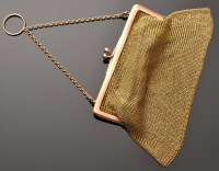 Lot 755 - A 9ct. yellow gold chain mail purse, with rose...