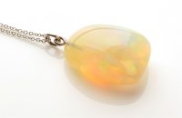 Lot 756 - An opal pendant, the pebble opal weighing...