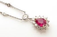 Lot 758 - A ruby and diamond cluster pendant, the pear...