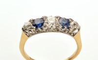 Lot 760 - A sapphire and diamond ring, the three...