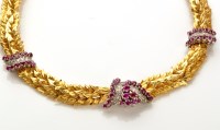 Lot 765 - A red stone diamond and yellow metal necklace,...