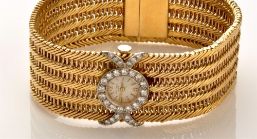 Lot 766 - An 18ct. yellow gold bracelet cocktail watch,...