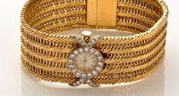 Lot 766 - An 18ct. yellow gold bracelet cocktail watch,...