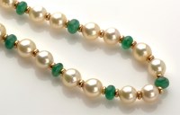 Lot 769 - A cultured pearl emerald and yellow metal...