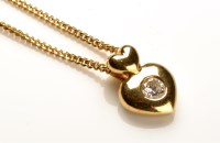 Lot 781 - A diamond set 18ct. yellow gold heart pattern...