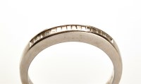 Lot 784 - A half hoop diamond eternity ring, the...