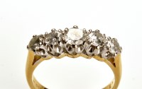 Lot 787 - A five stone diamond ring, the graduated...