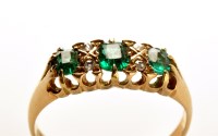 Lot 793 - A demantoid garnet and diamond ring, the three...