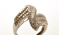 Lot 800 - A diamond ''zig-zag'' pattern ring, set with...