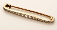 Lot 804 - An early 20th Century diamond bar brooch, the...