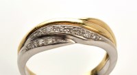 Lot 816 - A diamond dress ring, half white/half yellow...