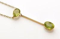 Lot 819 - An Edwardian peridot pendant, the oval facet...