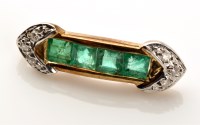 Lot 832 - An emerald and diamond pendant, four square...