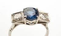 Lot 833 - A sapphire and diamond ring, the oval facet...