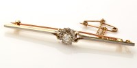 Lot 836 - A diamond cluster bar brooch, the central...