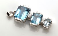 Lot 844 - An aquamarine and diamond pendant, set with...