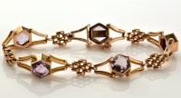 Lot 846 - An amethyst and 9ct. gold bracelet, with five...