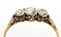 Lot 847 - A three stone diamond ring, the three tapered...