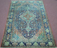 Lot 867 - An early 20th Century Kashan rug, with central...