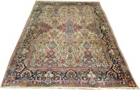 Lot 885 - A Kerman carpet, the field decorated with full...