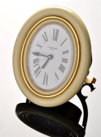 Lot 899 - Cartier, Paris: an oval travel clock, with...