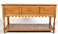 Lot 917 - A rectangular oak dresser, with three short...