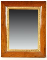 Lot 919 - A 19th Century wall mirror in parcel gilt...